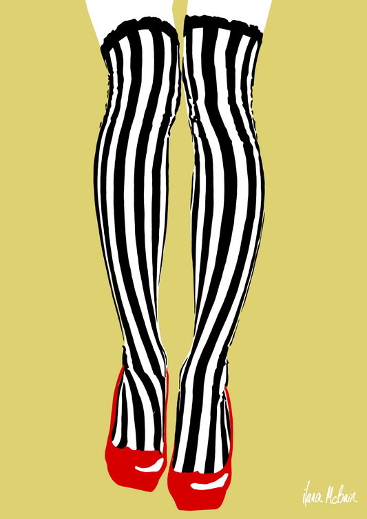 Black and white striped tights with red shoes on a beige background