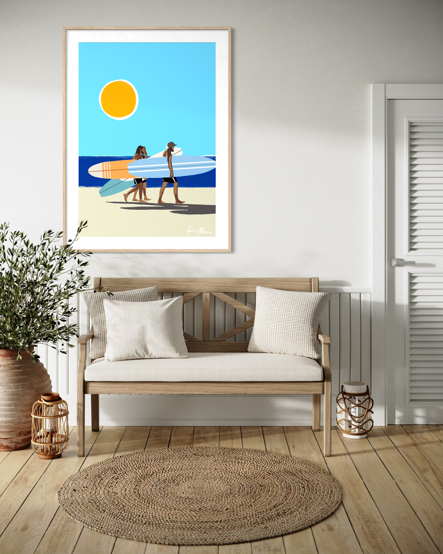 Interior mockup featuring Ilana McBain’s contemporary coastal artwork depicting surfers walking along the beach carrying surfboards under a bright summer sun.