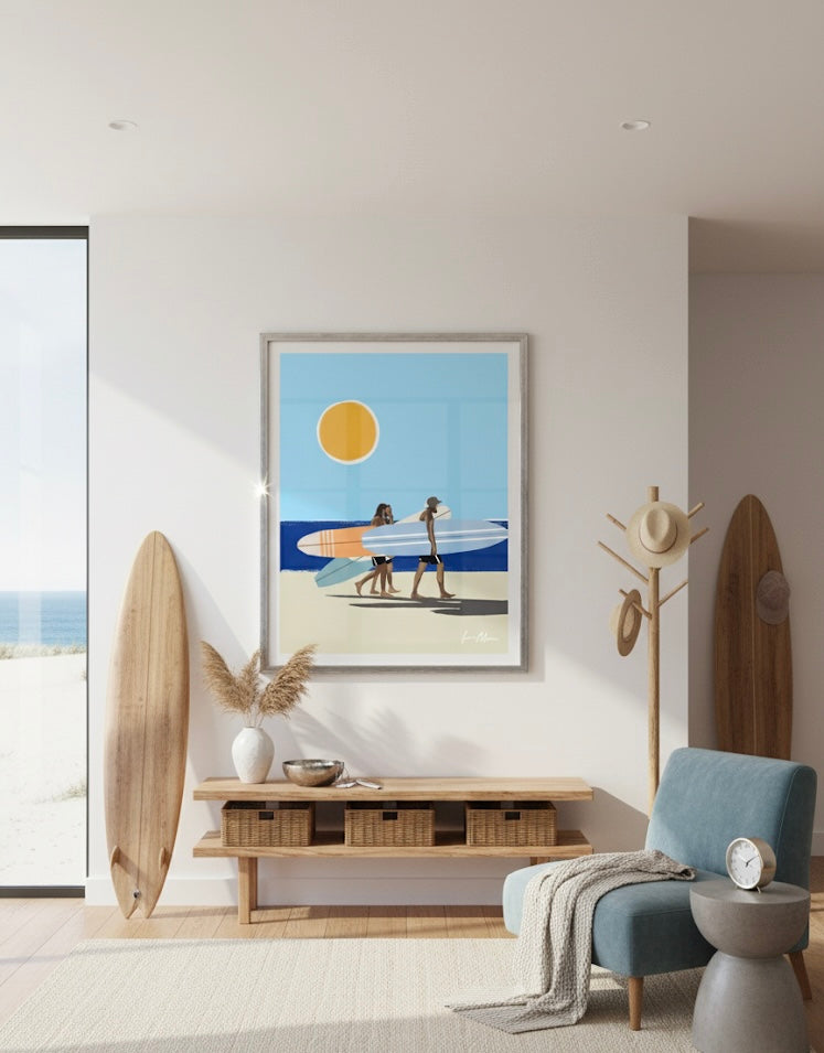 Three men with surfboards walking on a beach under a blue sky with a yellow sun. Poster on a beach house wall.
