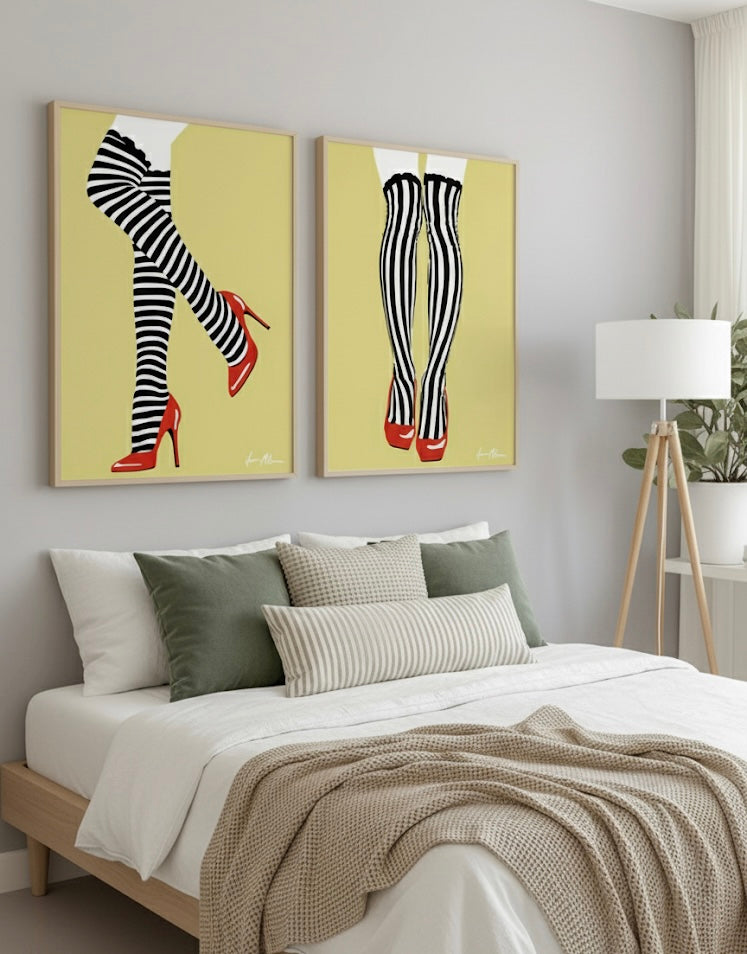 Bedroom with two abstract art pieces of black and white striped tights with red shoes on a golden yellow background on the wall above a bed.