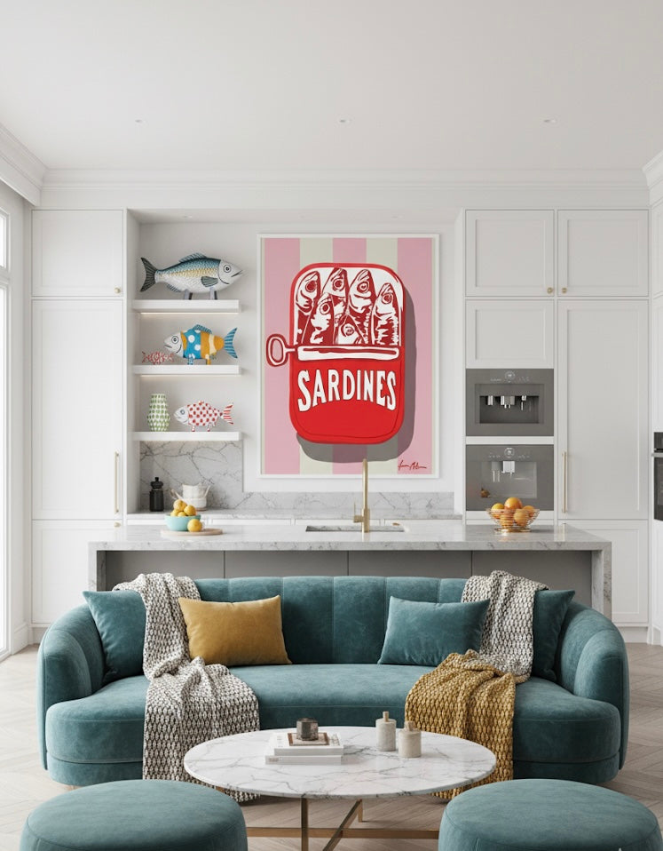 Modern kitchen with a blue sofa, round table, and colorful Art print painting of a sardine in a can on a pink and off white striped background on the wall.