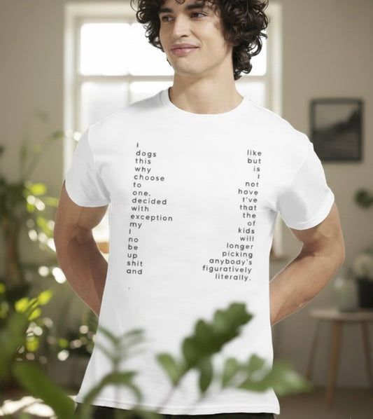 A young man with curly hair stands in a softly lit modern living room wearing a white graphic T-shirt featuring a vertical, text-based poetic design.