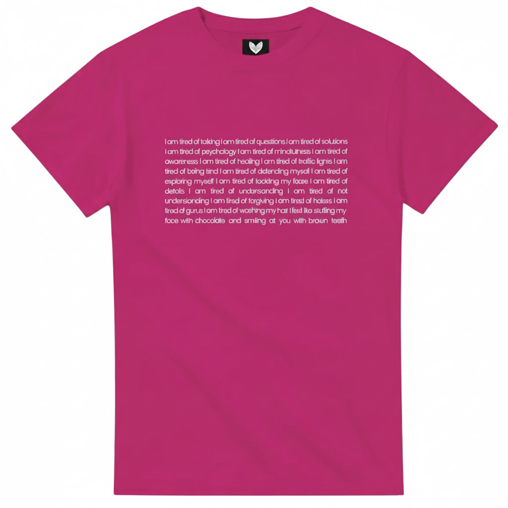 Pink t-shirt with white text featuring the poem “I am tired” by Ilana McBain.