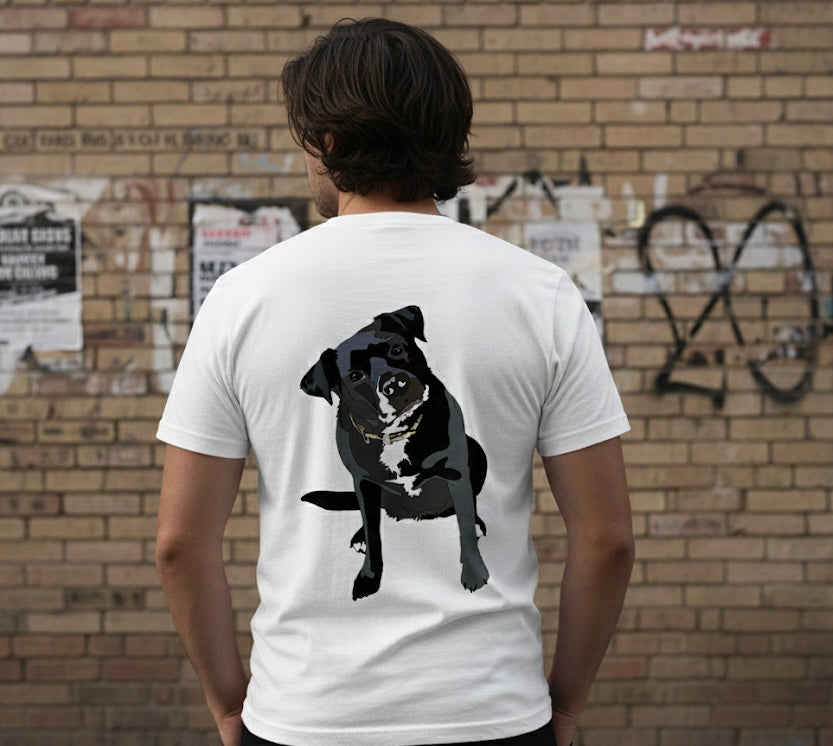 A model wearing a white t-shirt with a black dog graphic on the back, standing against a brick wall.