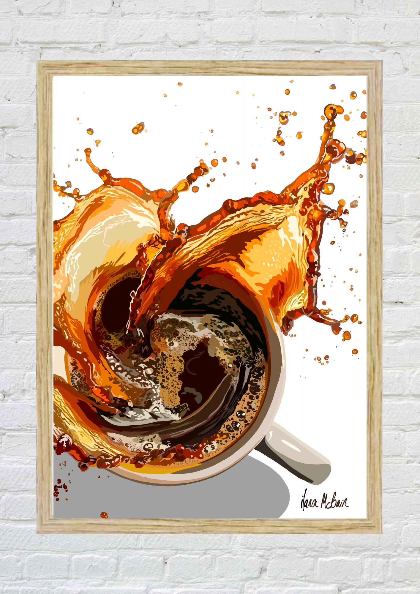 Framed artwork of a coffee cup with a splash on a white brick wall.