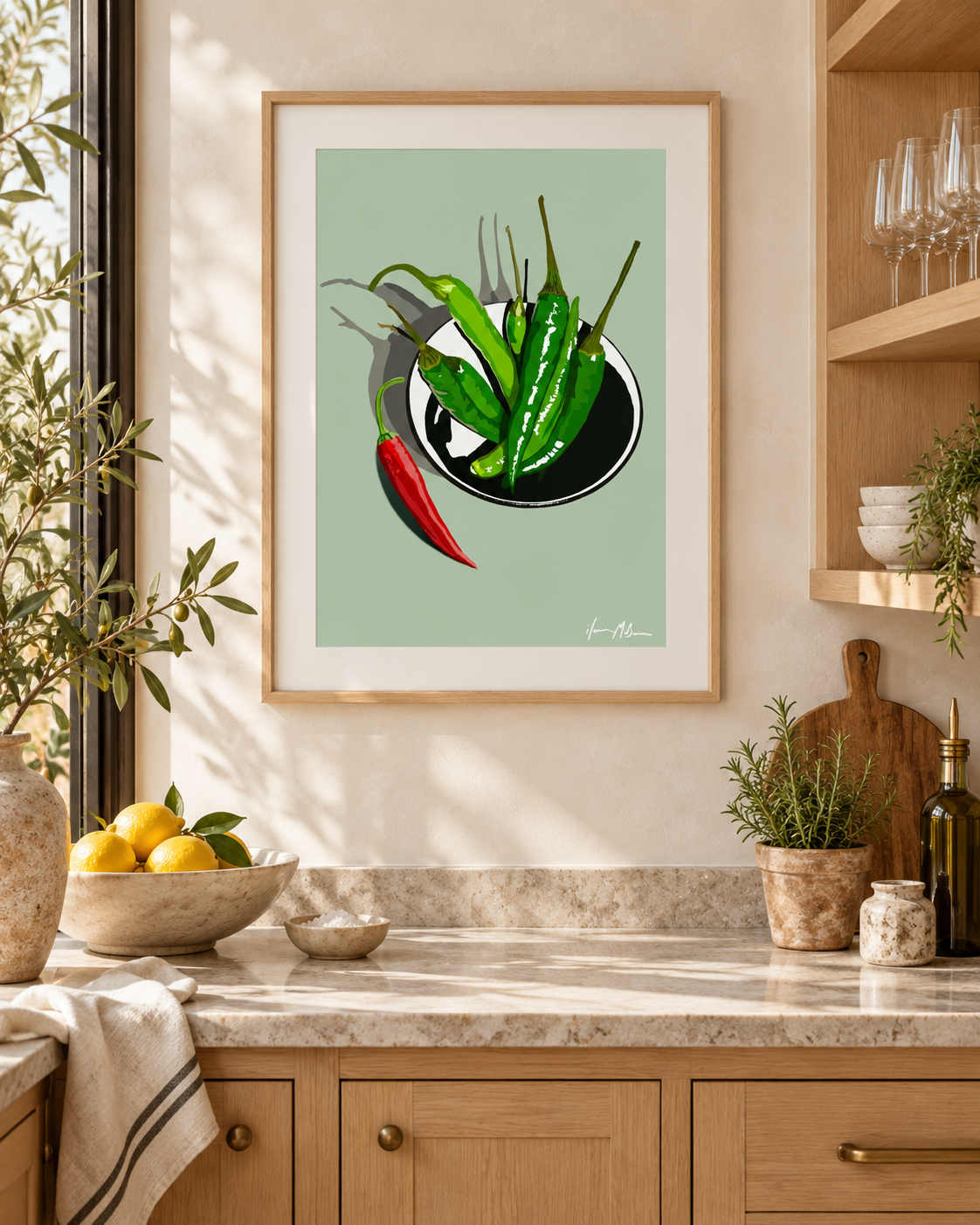 A Little Heat Sage contemporary chilli art print styled in a bright modern kitchen with natural timber cabinetry, stone surfaces and soft daylight.