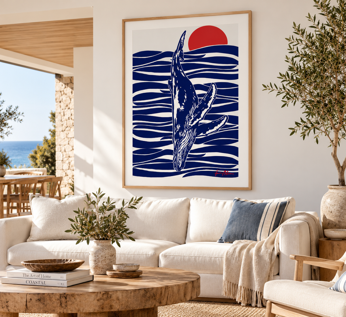 Between the Sun and the Sea humpback whale art print by Ilana McBain displayed in a bright coastal living room with natural timber and neutral furnishings.