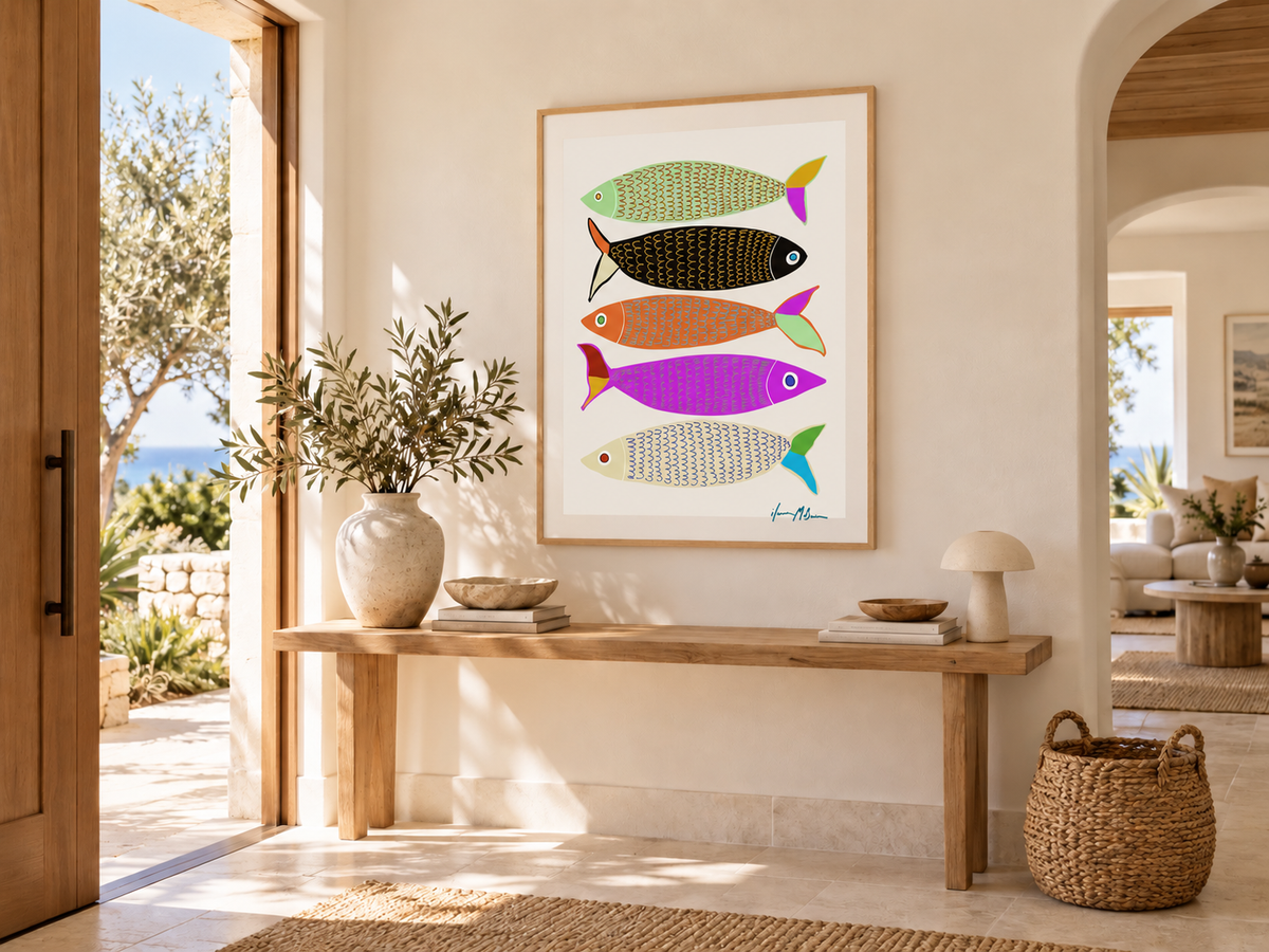 Chic Sardines colourful contemporary fish art print by Ilana McBain displayed in a bright Mediterranean-inspired entry hall with natural timber and warm neutral styling.