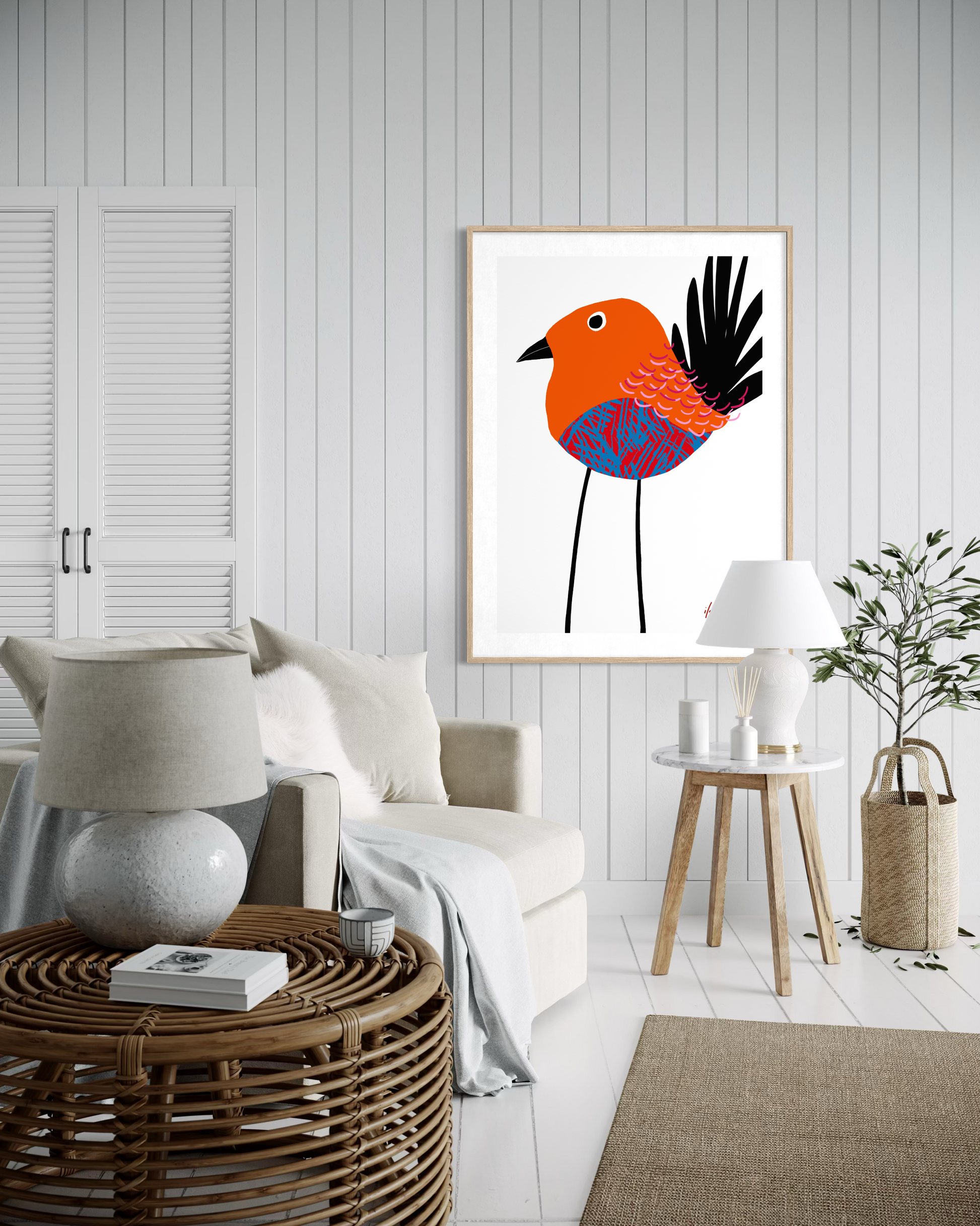 Feathered Serenity bird wall art by Australian artist Ilana McBain displayed in a modern Scandinavian style living room interior. Contemporary colourful bird artwork printed on museum quality cotton rag paper.
