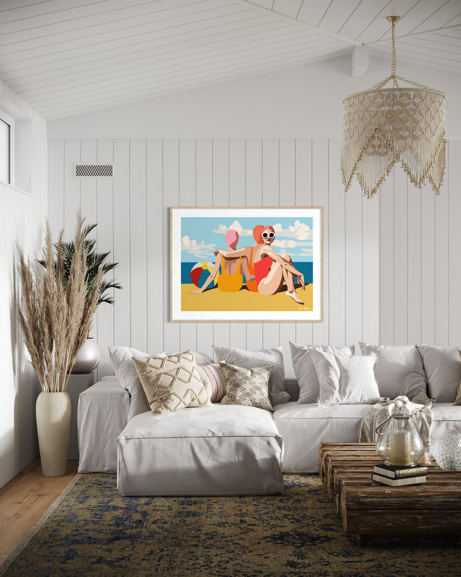 Interior mockup featuring Ilana McBain’s contemporary beach artwork depicting two women relaxing by the ocean with summer colours and coastal atmosphere.
