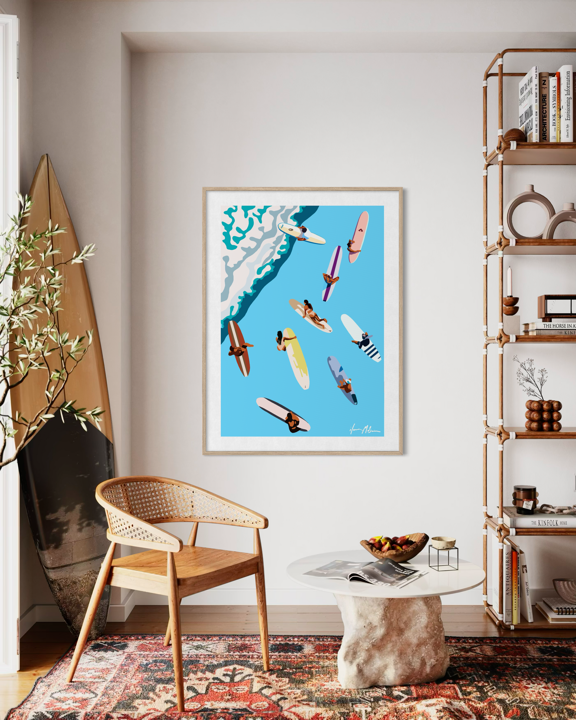 Contemporary surf wall art by Australian artist Ilana McBain showing surfers floating on colourful surfboards viewed from above, displayed in a modern coastal living room interior.