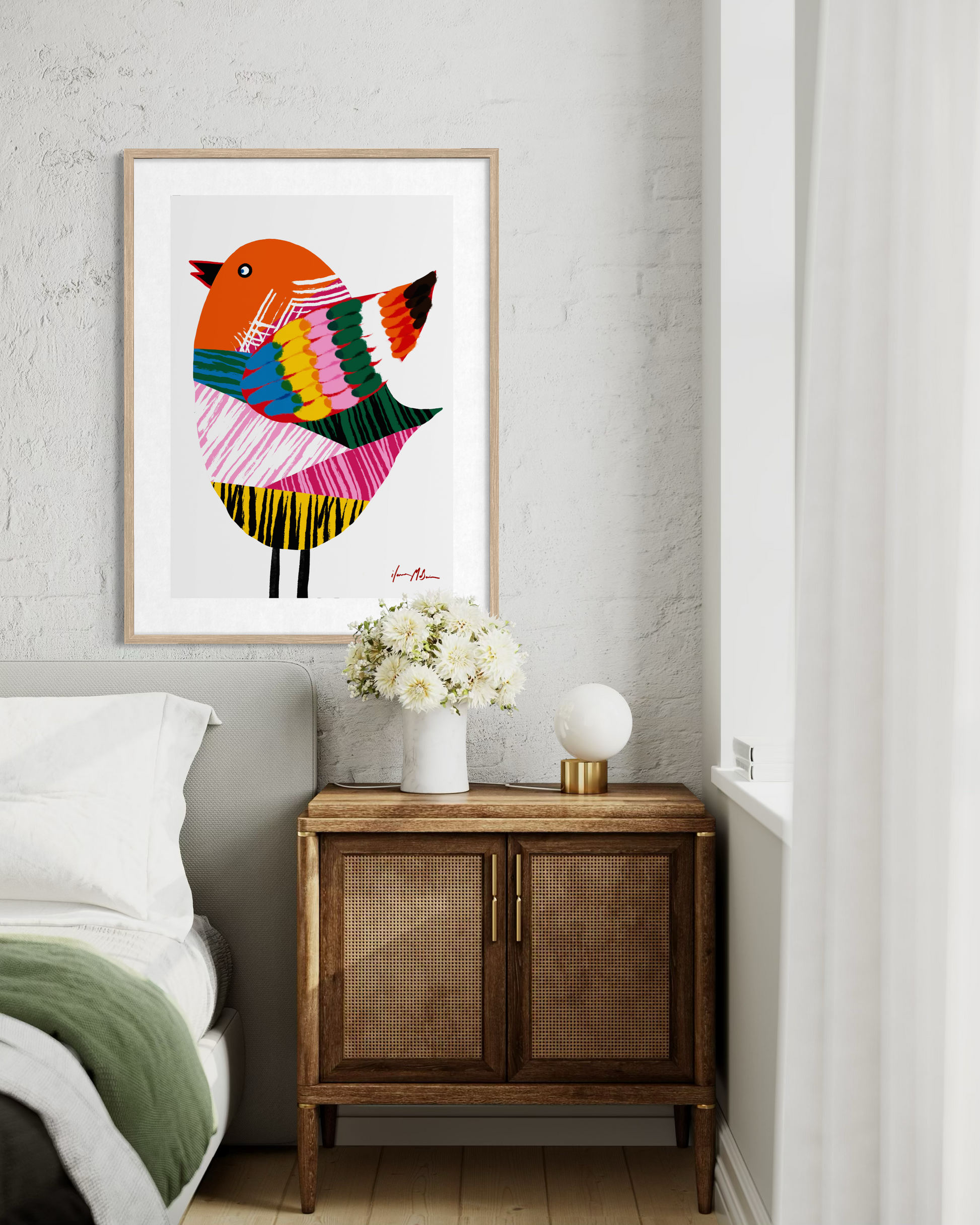 Contemporary pop art bird artwork by Australian artist Ilana McBain displayed as framed wall art above bedside cabinet in modern bedroom interior.