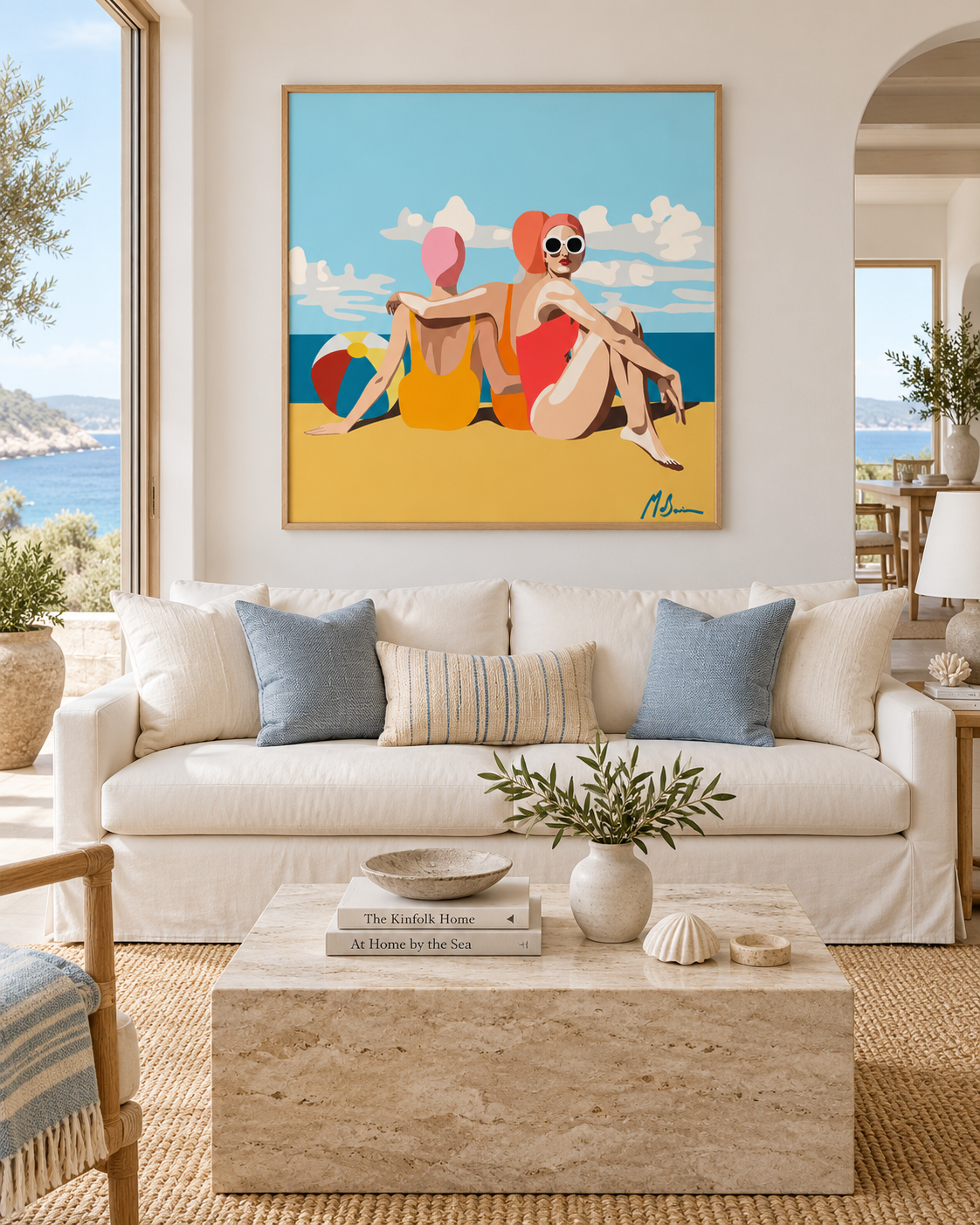 Girlfriends on the Beach by Ilana McBain displayed in a bright contemporary coastal living room with ocean views and neutral furnishings.