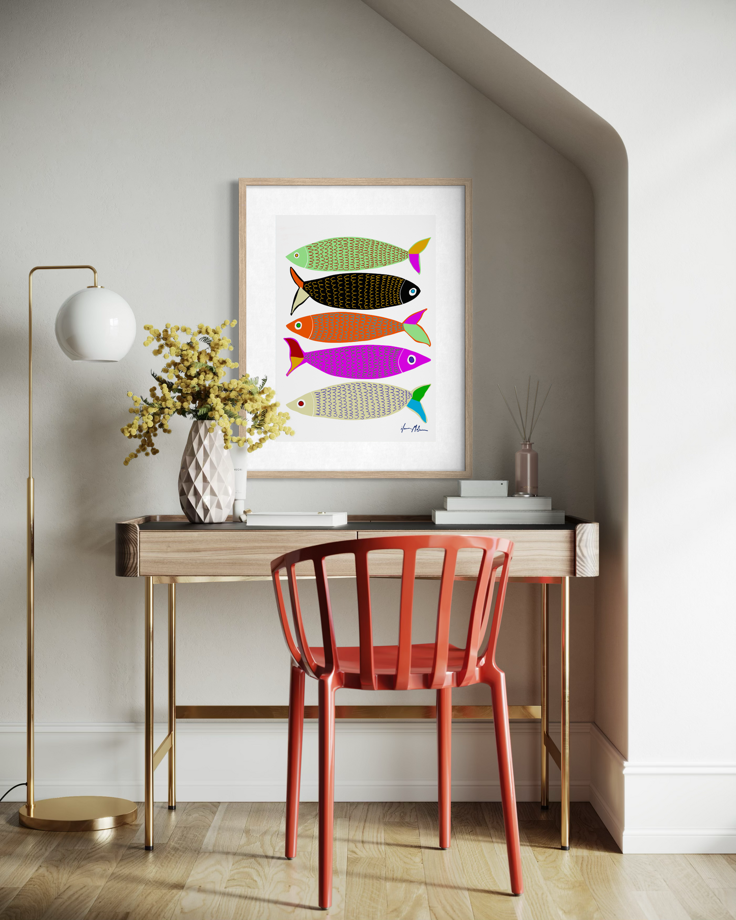 Interior mockup of the contemporary artwork “Sardines” by Ilana McBain showing colourful stylised fish arranged in a graphic composition, displayed above a desk in a modern home office interior.
