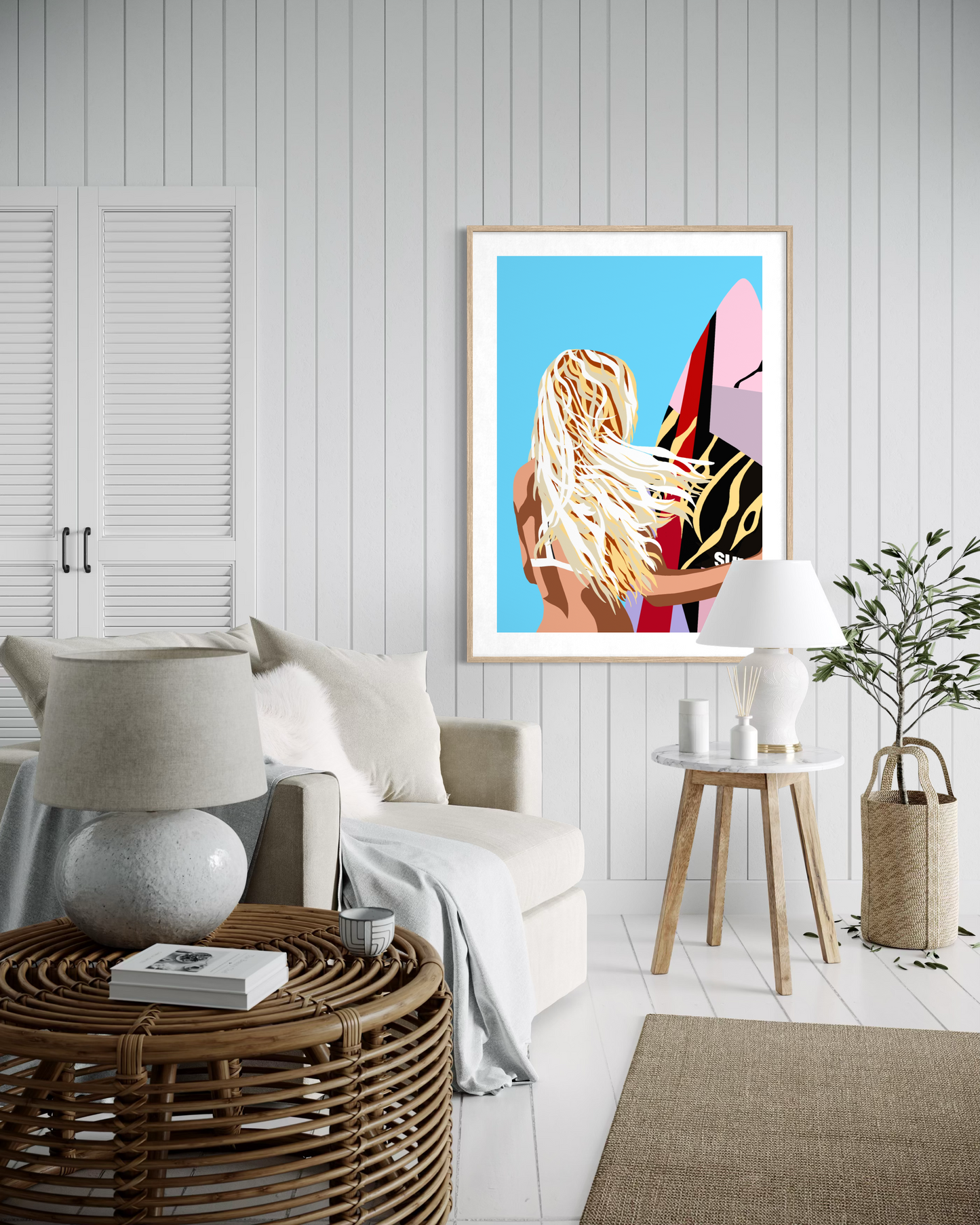 Contemporary coastal surf artwork by Australian artist Ilana McBain featuring a blonde surfer girl holding a surfboard with wind in her hair displayed as framed beach house wall art.