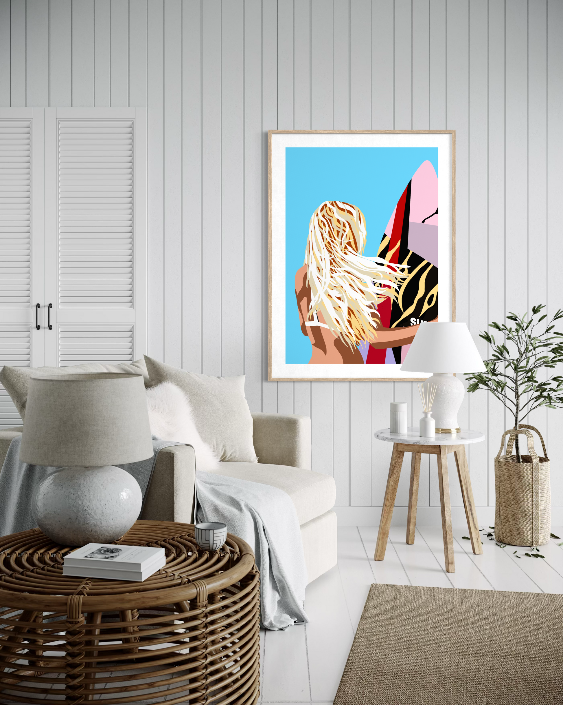 Contemporary coastal surf artwork by Australian artist Ilana McBain featuring a blonde surfer girl holding a surfboard with wind in her hair displayed as framed beach house wall art.