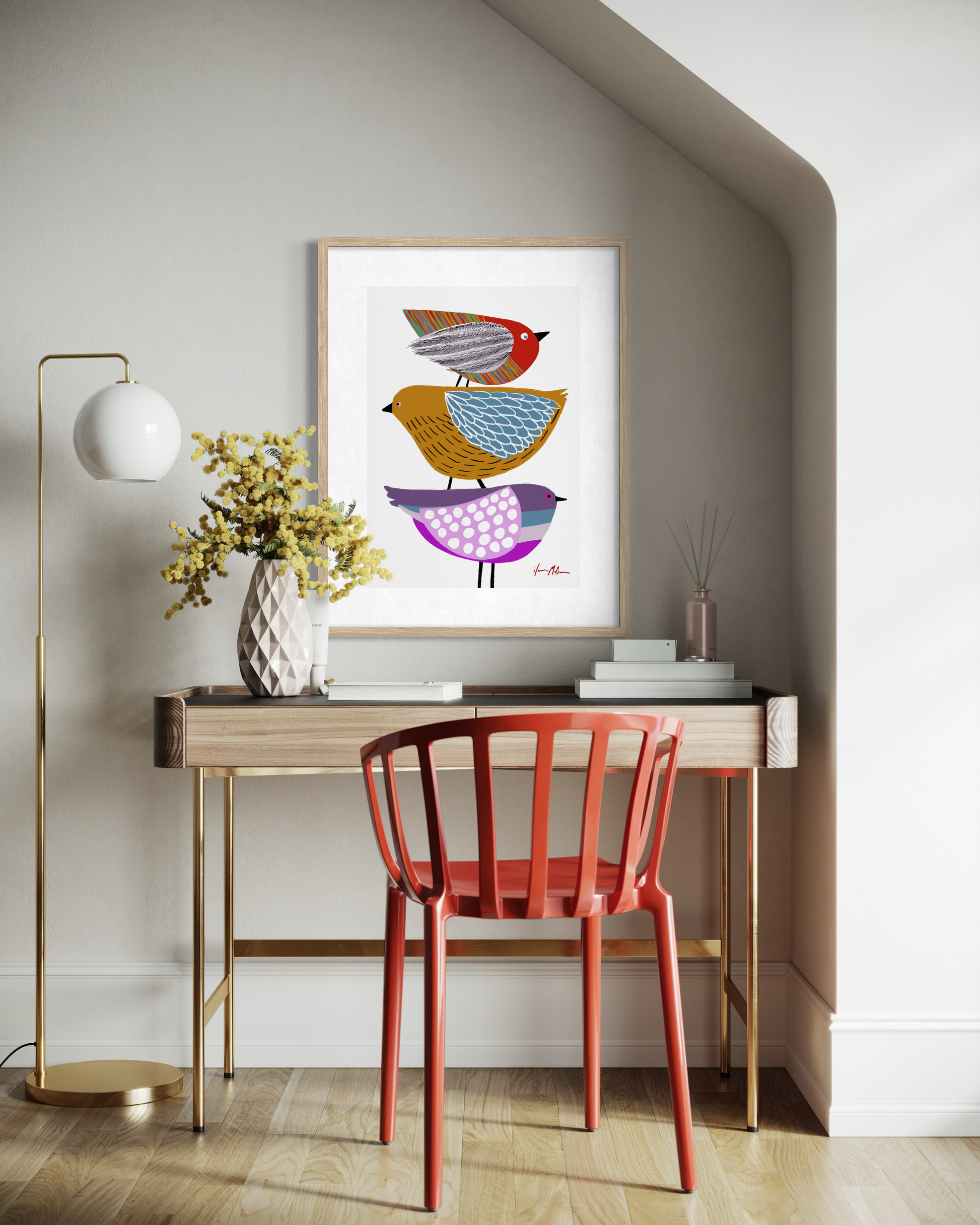 Contemporary colourful bird artwork featuring three stylised birds by Australian artist Ilana McBain displayed as framed wall art above a modern home office desk.