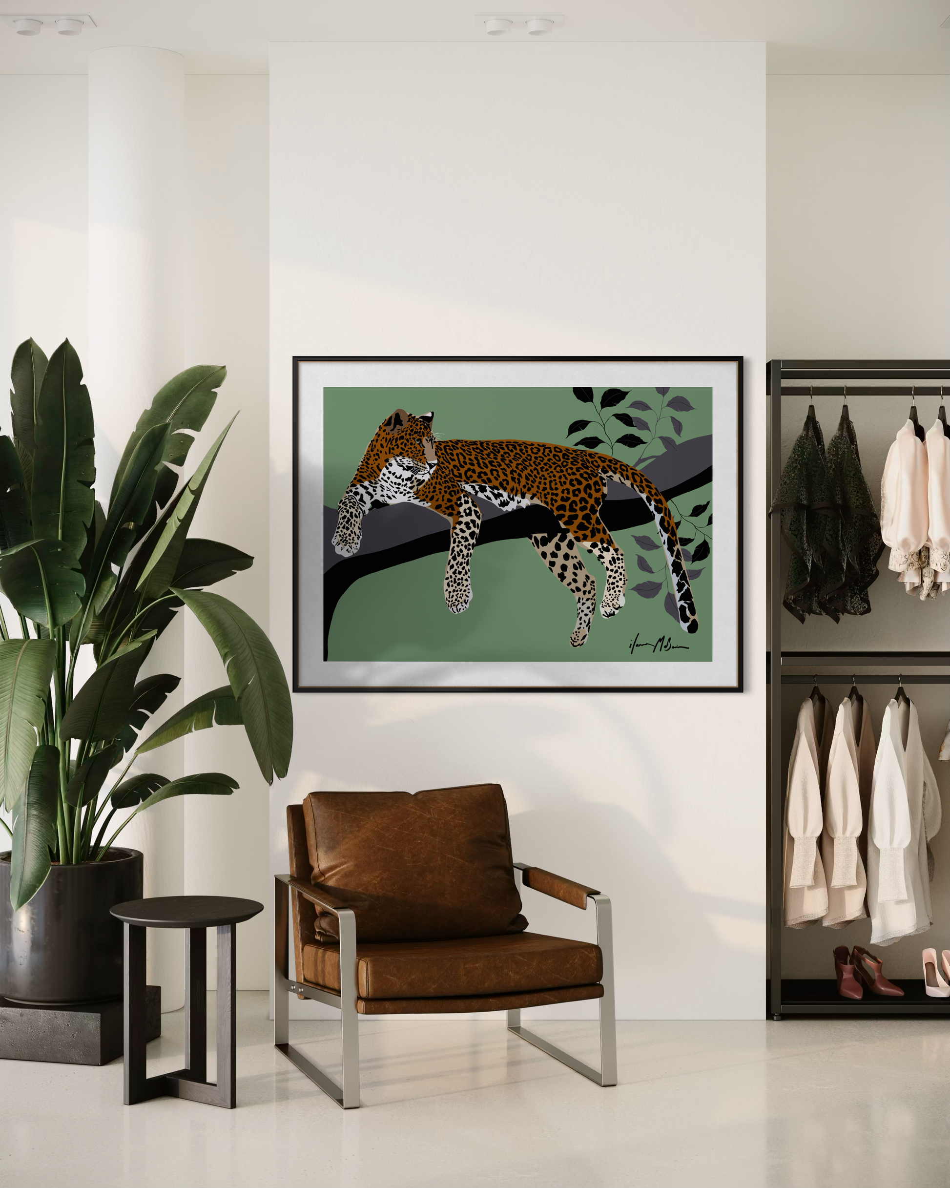 Untamed leopard fine art print by Ilana McBain displayed in a contemporary interior with chair and plant.