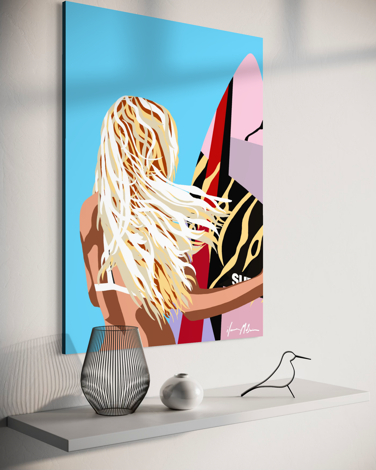 Contemporary surf artwork “Surf Whisperer” by Ilana McBain shown in elegant beach house interior mock-up celebrating connection between surfer and ocean. Side view.
