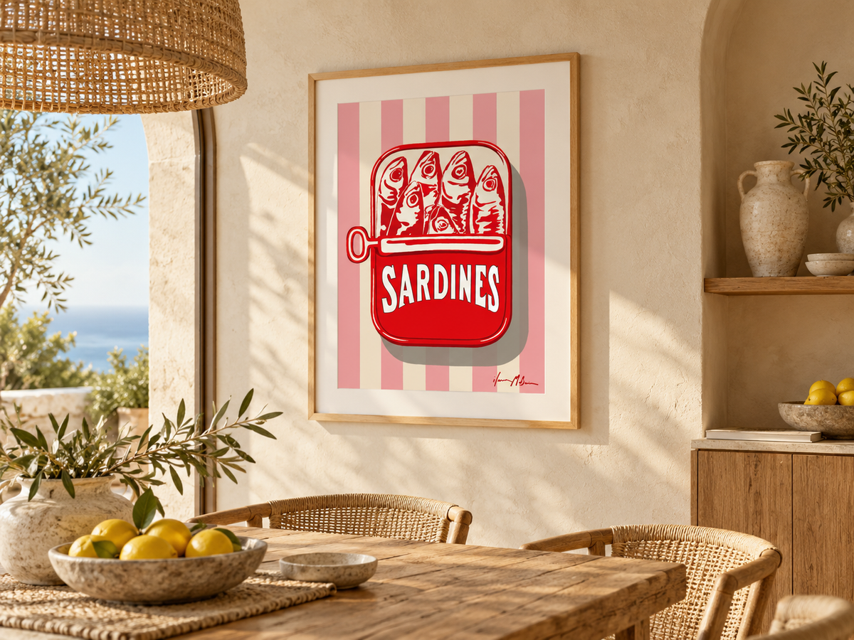 The Sardine Tin pink stripe art print displayed in a sunlit Mediterranean-style dining room with natural timber furniture, woven chairs and warm neutral finishes.