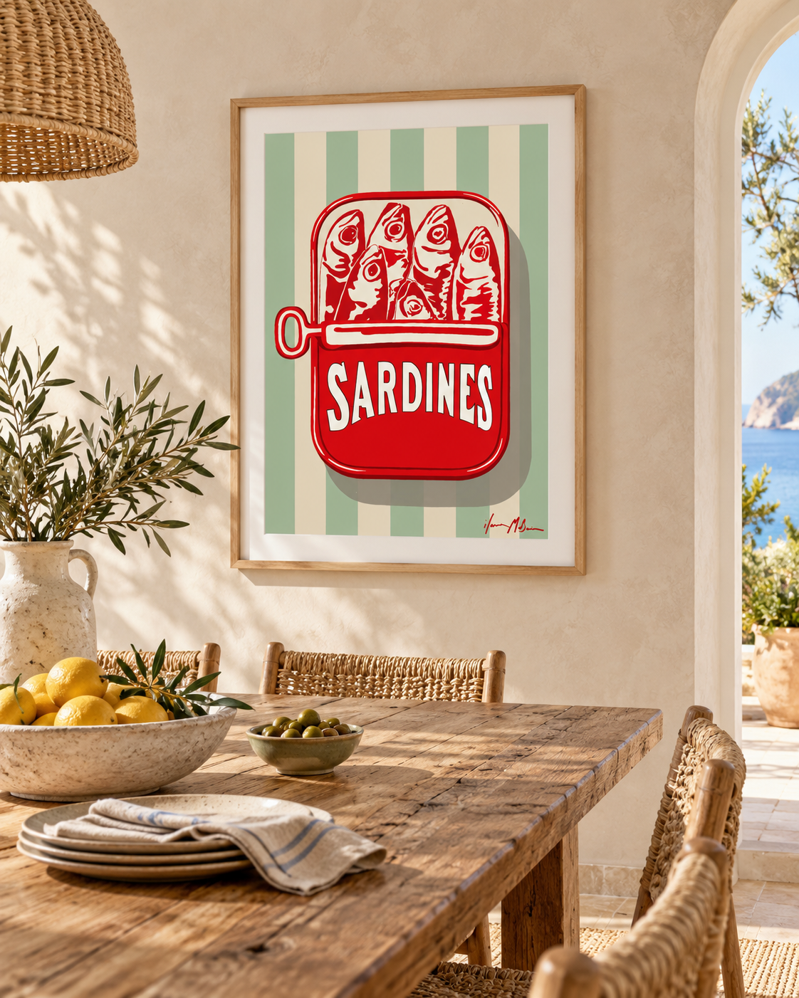 The Sardine Tin sage stripe art print displayed in a sunlit Mediterranean-style dining room with natural timber furniture, woven chairs and warm neutral finishes.