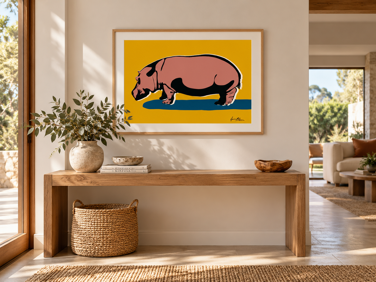 Solid contemporary hippo art print by Ilana McBain displayed above a timber console in a warm modern entry hall with natural styling.